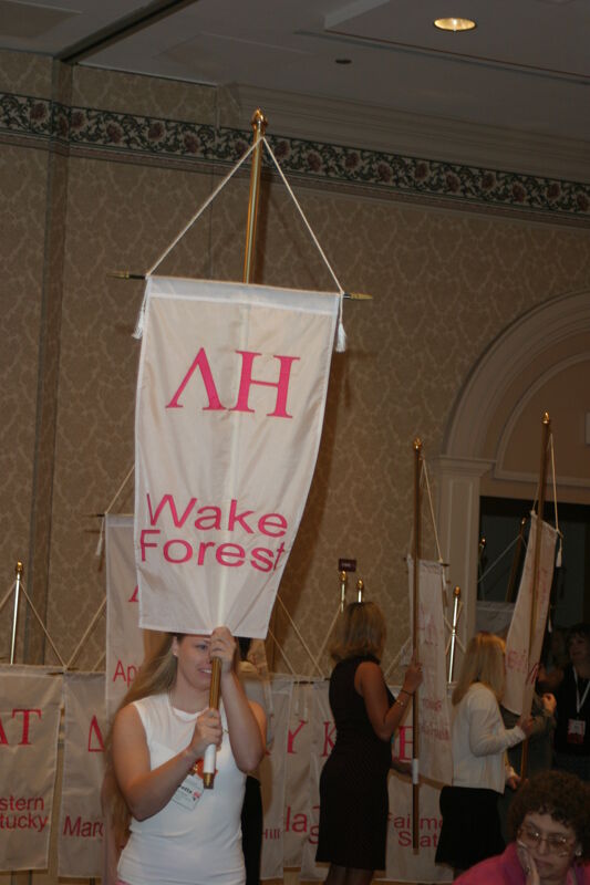 Unidentified Phi Mu With Lambda Eta Chapter Banner in Convention Parade of Flags Photograph, July 9, 2004 (Image)