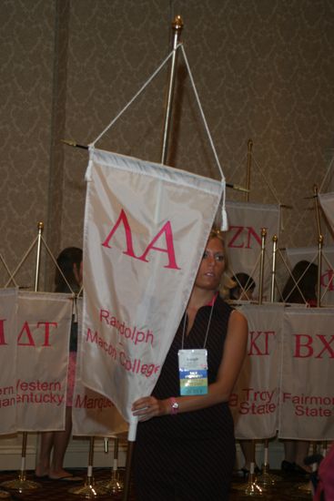 Unidentified Phi Mu With Lambda Alpha Chapter Banner in Convention Parade of Flags Photograph, July 9, 2004 (image)