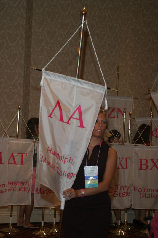 Unidentified Phi Mu With Lambda Alpha Chapter Banner in Convention Parade of Flags Photograph, July 9, 2004 (Image)