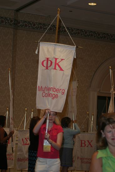 Dorie Morgan With Phi Kappa Chapter Banner in Convention Parade of Flags Photograph, July 9, 2004 (image)