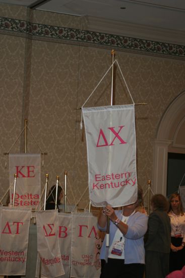 Unidentified Phi Mu With Delta Chi Chapter Banner in Convention Parade of Flags Photograph, July 9, 2004 (image)