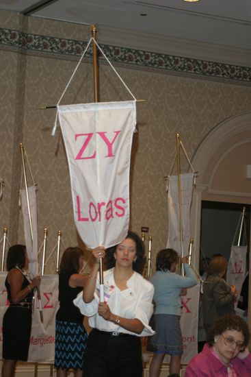 Unidentified Phi Mu With Zeta Upsilon Chapter Banner in Convention Parade of Flags Photograph, July 9, 2004 (image)