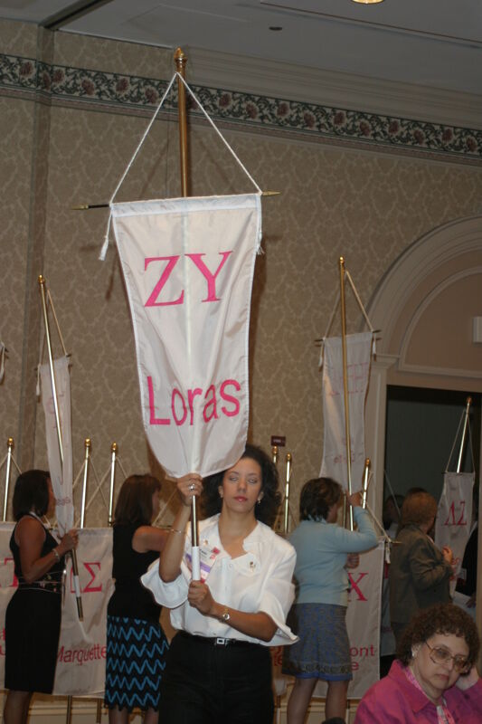 Unidentified Phi Mu With Zeta Upsilon Chapter Banner in Convention Parade of Flags Photograph, July 9, 2004 (Image)