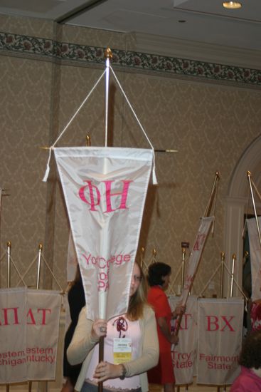 Jersey Gillespie With Phi Eta Chapter Banner in Convention Parade of Flags Photograph, July 9, 2004 (image)