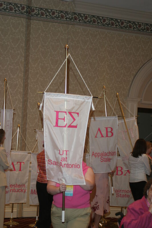 Unidentified Phi Mu With Epsilon Sigma Chapter Banner in Convention Parade of Flags Photograph, July 9, 2004 (Image)