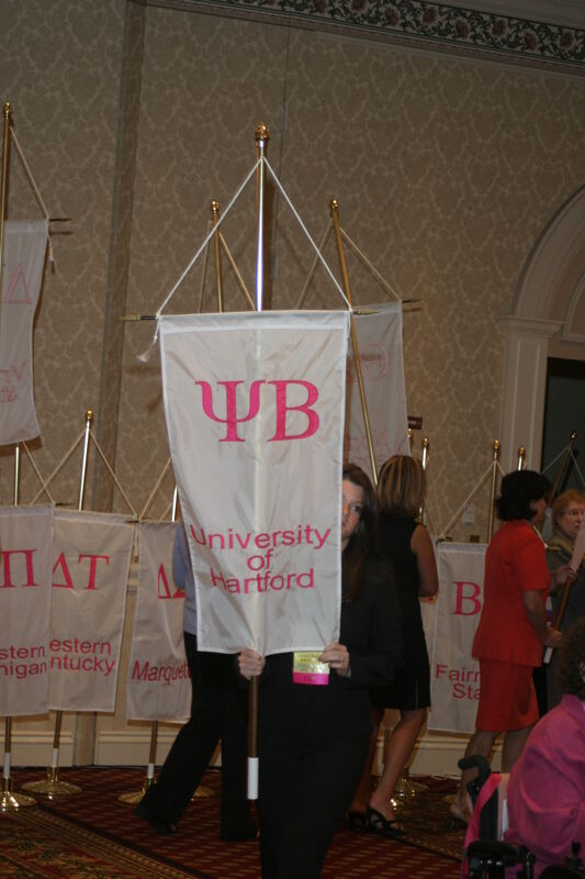 Unidentified Phi Mu With Psi Beta Chapter Banner in Convention Parade of Flags Photograph, July 9, 2004 (Image)