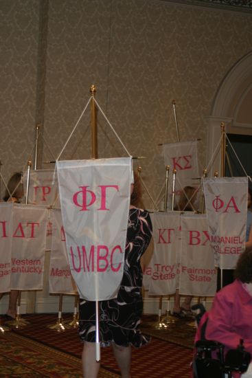 Unidentified Phi Mu With Phi Gamma Chapter Banner in Convention Parade of Flags Photograph, July 9, 2004 (image)