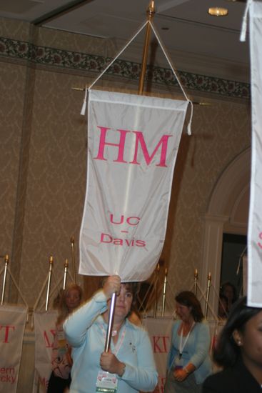 Katie Eastham With Eta Mu Chapter Banner in Convention Parade of Flags Photograph, July 9, 2004 (image)