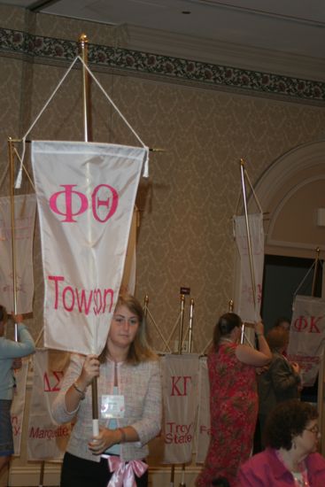 Unidentified Phi Mu With Phi Theta Chapter Banner in Convention Parade of Flags Photograph, July 9, 2004 (image)