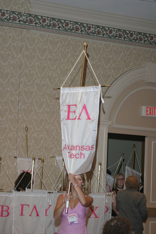 Unidentified Phi Mu With Epsilon Lambda Chapter Banner in Convention Parade of Flags Photograph, July 9, 2004 (Image)