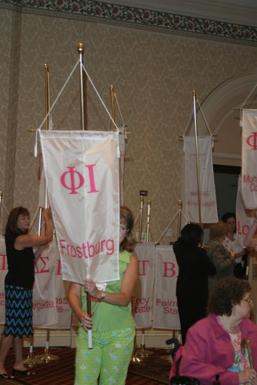 Unidentified Phi Mu With Phi Iota Chapter Banner in Convention Parade of Flags Photograph, July 9, 2004 (image)