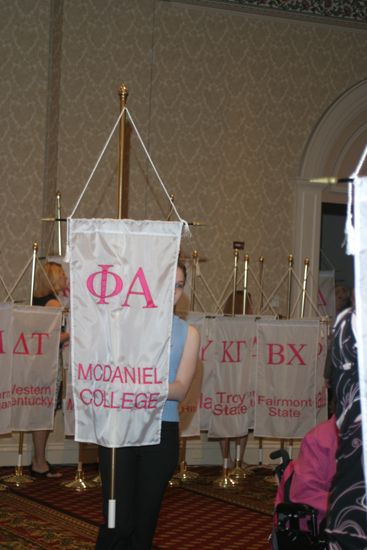 Unidentified Phi Mu With Phi Alpha Chapter Banner in Convention Parade of Flags Photograph, July 9, 2004 (image)