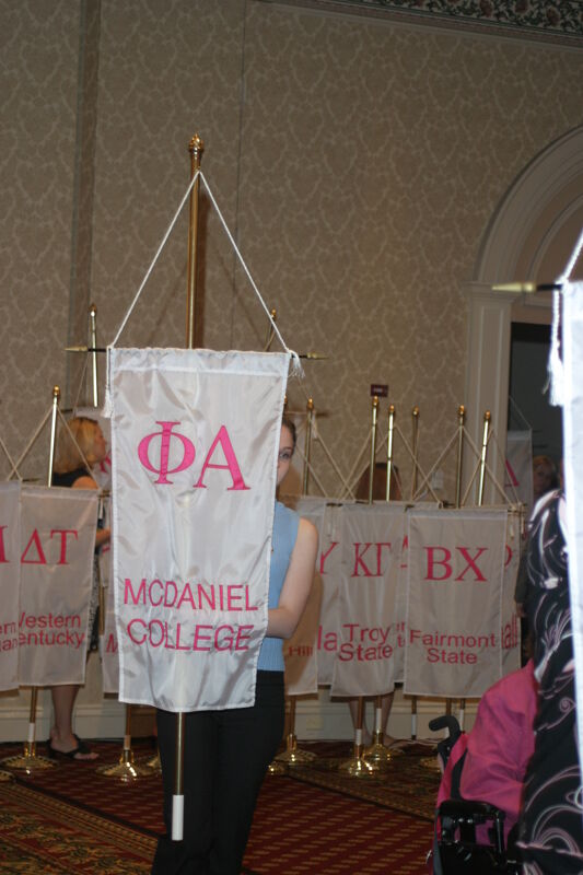 Unidentified Phi Mu With Phi Alpha Chapter Banner in Convention Parade of Flags Photograph, July 9, 2004 (Image)