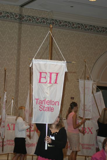 Unidentified Phi Mu With Epsilon Pi Chapter Banner in Convention Parade of Flags Photograph, July 9, 2004 (image)