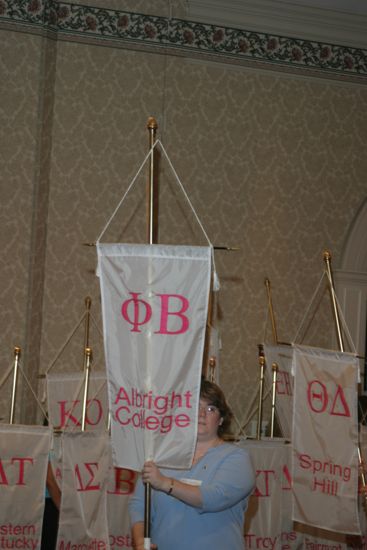 Unidentified Phi Mu With Phi Beta Chapter Banner in Convention Parade of Flags Photograph, July 9, 2004 (image)