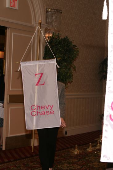 Unidentified Phi Mu With Zeta Chapter Banner in Convention Parade of Flags Photograph, July 9, 2004 (image)