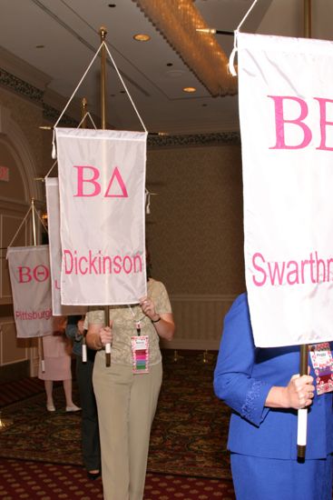 Nancy Campbell With Beta Delta Chapter Banner in Convention Parade of Flags Photograph, July 9, 2004 (image)