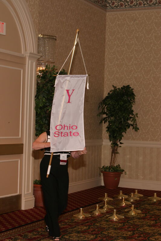 Unidentified Phi Mu With Upsilon Chapter Banner in Convention Parade of Flags Photograph, July 9, 2004 (Image)