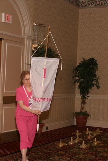 Unidentified Phi Mu With Iota Chapter Banner in Convention Parade of Flags Photograph, July 9, 2004 (image)