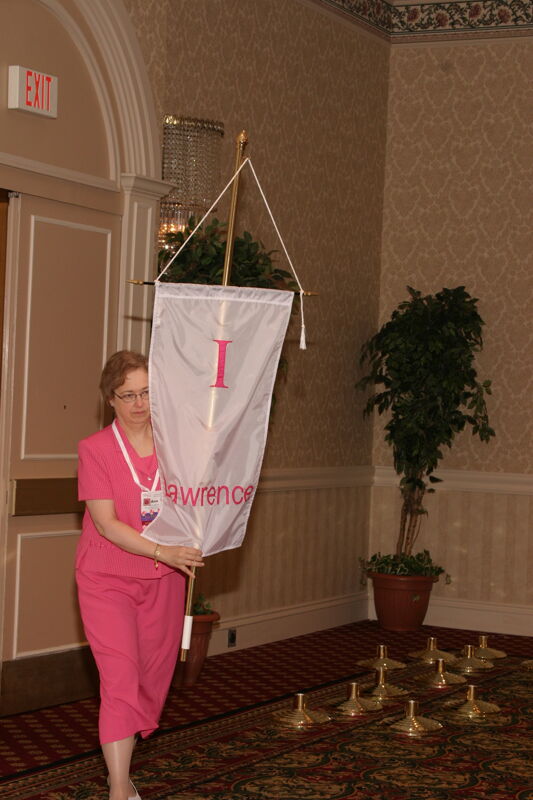 Unidentified Phi Mu With Iota Chapter Banner in Convention Parade of Flags Photograph, July 9, 2004 (Image)