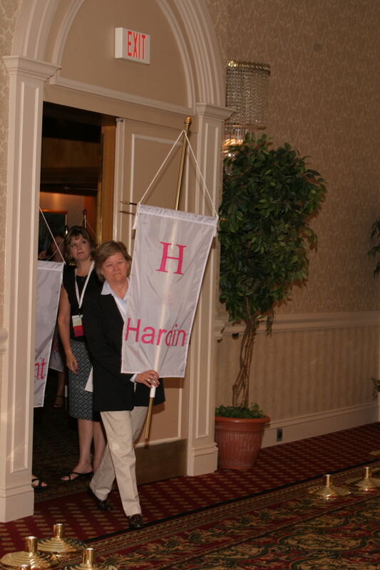 Unidentified Phi Mu With Eta Chapter Banner in Convention Parade of Flags Photograph, July 9, 2004 (Image)