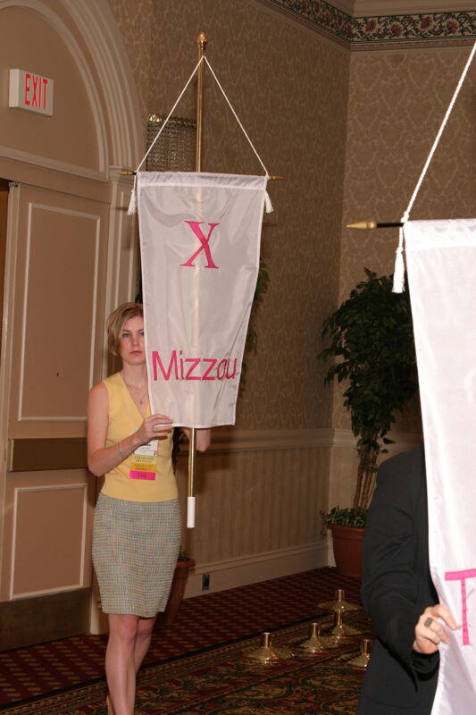 Unidentified Phi Mu With Chi Chapter Banner in Convention Parade of Flags Photograph, July 9, 2004 (Image)