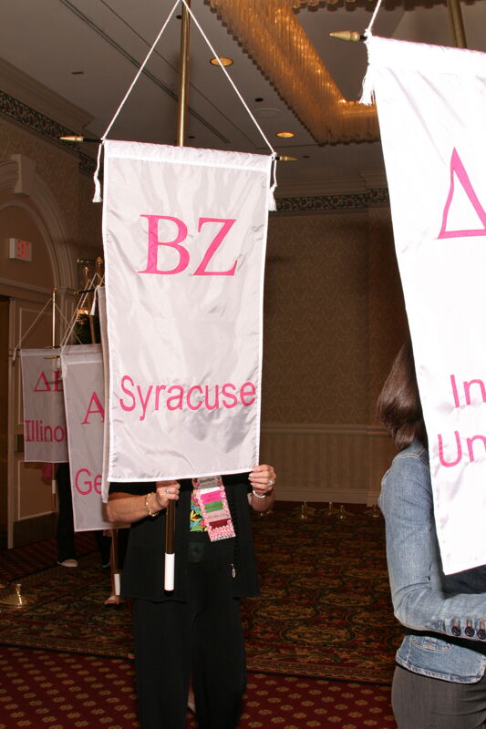Shellye McCarty With Beta Zeta Chapter Banner in Convention Parade of Flags Photograph, July 9, 2004 (Image)