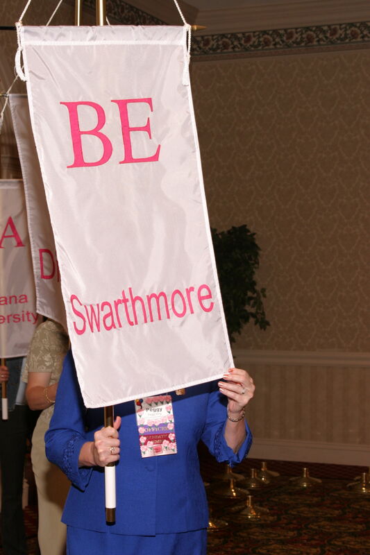 Peggy King With Beta Epsilon Chapter Banner in Convention Parade of Flags Photograph, July 9, 2004 (Image)