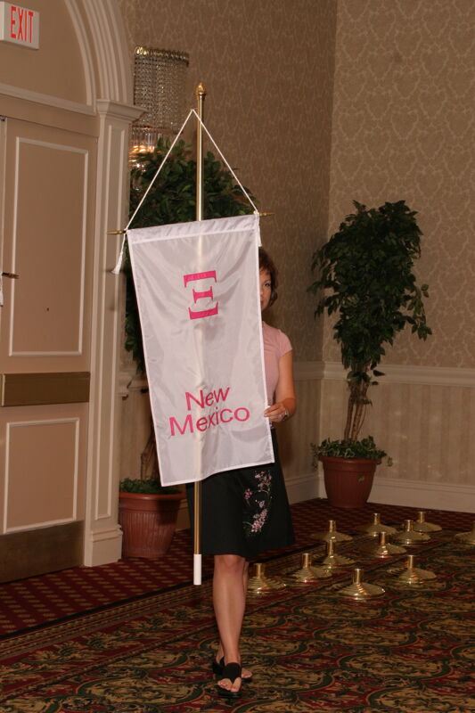 Unidentified Phi Mu With Xi Chapter Banner in Convention Parade of Flags Photograph, July 9, 2004 (Image)