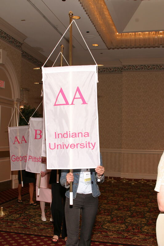 Unidentified Phi Mu With Delta Alpha Chapter Banner in Convention Parade of Flags Photograph, July 9, 2004 (Image)