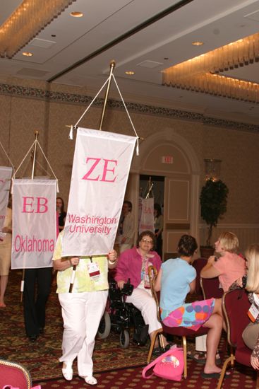 Unidentified Phi Mu With Zeta Epsilon Chapter Banner in Convention Parade of Flags Photograph, July 9, 2004 (image)