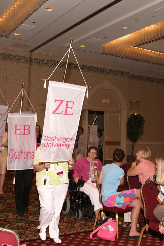 Unidentified Phi Mu With Zeta Epsilon Chapter Banner in Convention Parade of Flags Photograph, July 9, 2004 (Image)
