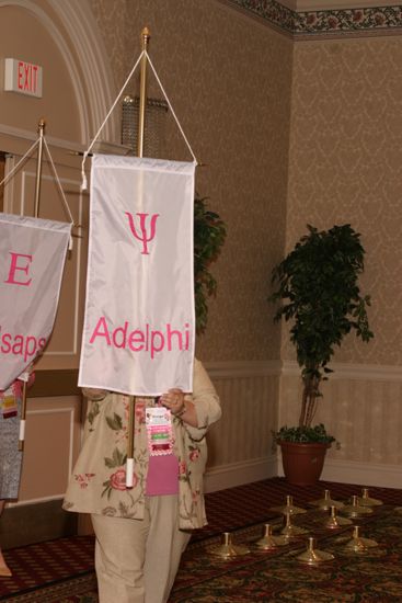 Margo Grace With Psi Chapter Banner in Convention Parade of Flags Photograph, July 9, 2004 (image)