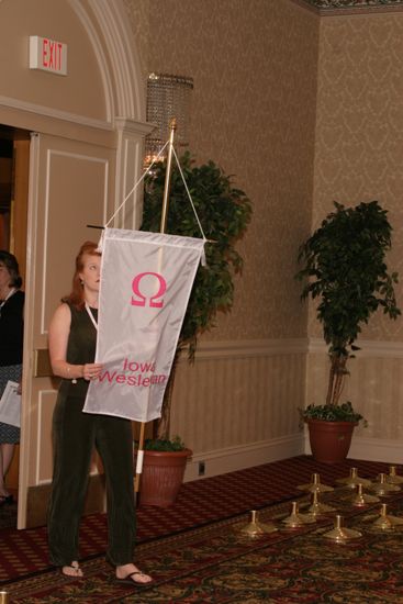 Unidentified Phi Mu With Omega Chapter Banner in Convention Parade of Flags Photograph, July 9, 2004 (image)