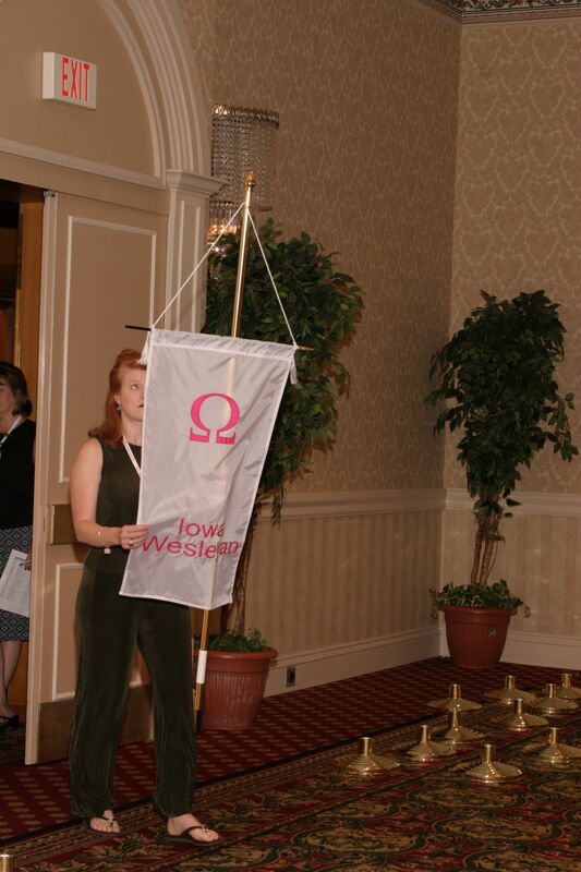 Unidentified Phi Mu With Omega Chapter Banner in Convention Parade of Flags Photograph, July 9, 2004 (Image)