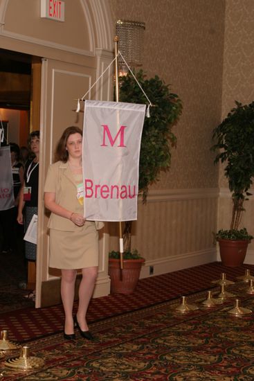 Unidentified Phi Mu With Mu Chapter Banner in Convention Parade of Flags Photograph, July 9, 2004 (image)