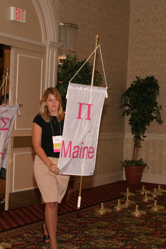 Unidentified Phi Mu With Pi Chapter Banner in Convention Parade of Flags Photograph, July 9, 2004 (Image)