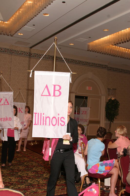 Unidentified Phi Mu With Delta Beta Chapter Banner in Convention Parade of Flags Photograph, July 9, 2004 (Image)