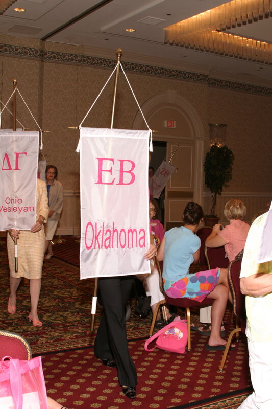 Unidentified Phi Mu With Epsilon Beta Chapter Banner in Convention Parade of Flags Photograph, July 9, 2004 (Image)