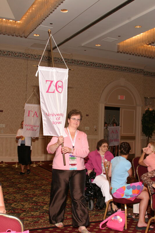 Unidentified Phi Mu With Zeta Theta Chapter Banner in Convention Parade of Flags Photograph, July 9, 2004 (Image)