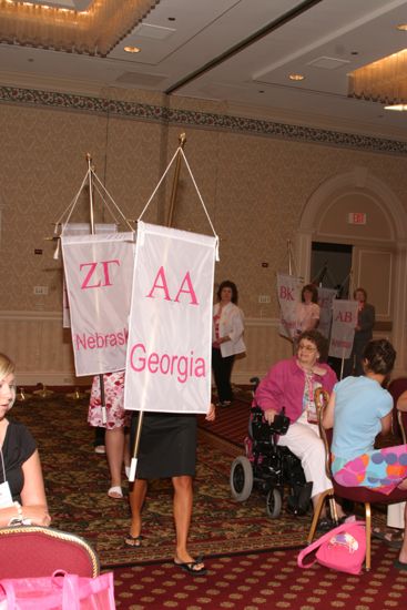 Unidentified Phi Mu With Alpha Alpha Chapter Banner in Convention Parade of Flags Photograph, July 9, 2004 (image)