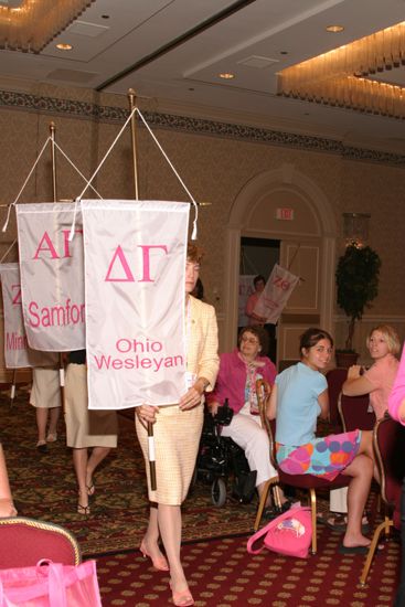 Unidentified Phi Mu With Delta Gamma Chapter Banner in Convention Parade of Flags Photograph, July 9, 2004 (image)