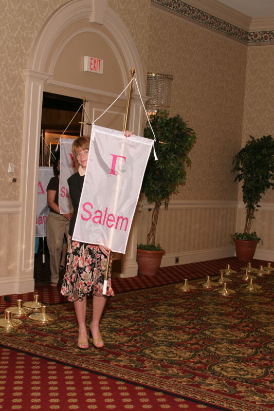 Unidentified Phi Mu With Gamma Chapter Banner in Convention Parade of Flags Photograph, July 9, 2004 (Image)