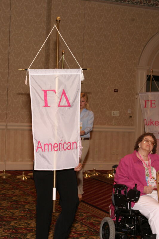 Unidentified Phi Mu With Gamma Delta Chapter Banner in Convention Parade of Flags Photograph, July 9, 2004 (Image)