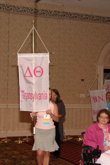 Unidentified Phi Mu With Delta Theta Chapter Banner in Convention Parade of Flags Photograph, July 9, 2004 (image)