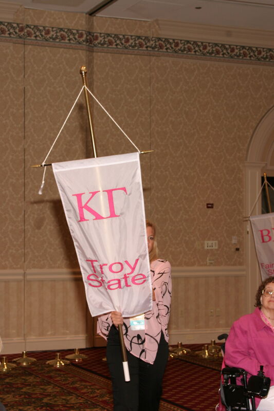 Unidentified Phi Mu With Kappa Gamma Chapter Banner in Convention Parade of Flags Photograph, July 9, 2004 (Image)