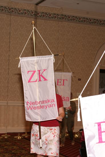 Unidentified Phi Mu With Zeta Kappa Chapter Banner in Convention Parade of Flags Photograph, July 9, 2004 (image)