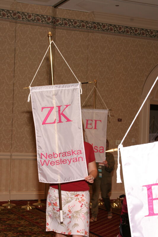 Unidentified Phi Mu With Zeta Kappa Chapter Banner in Convention Parade of Flags Photograph, July 9, 2004 (Image)