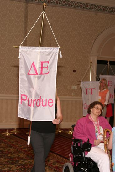 Unidentified Phi Mu With Delta Epsilon Chapter Banner in Convention Parade of Flags Photograph, July 9, 2004 (image)