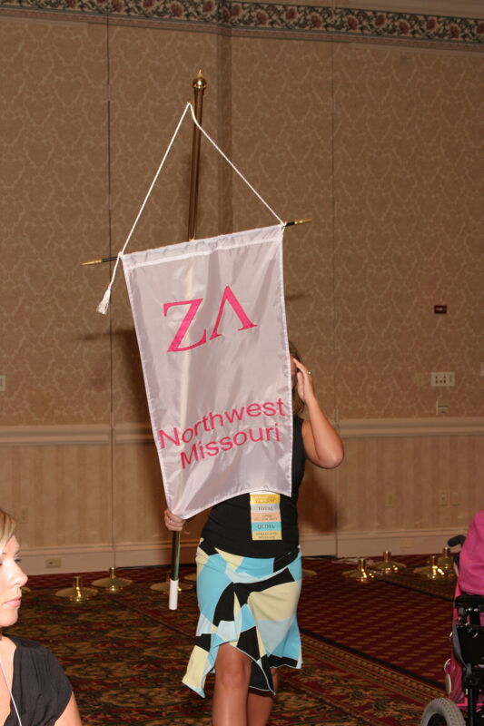 Unidentified Phi Mu With Zeta Lambda Chapter Banner in Convention Parade of Flags Photograph, July 9, 2004 (Image)